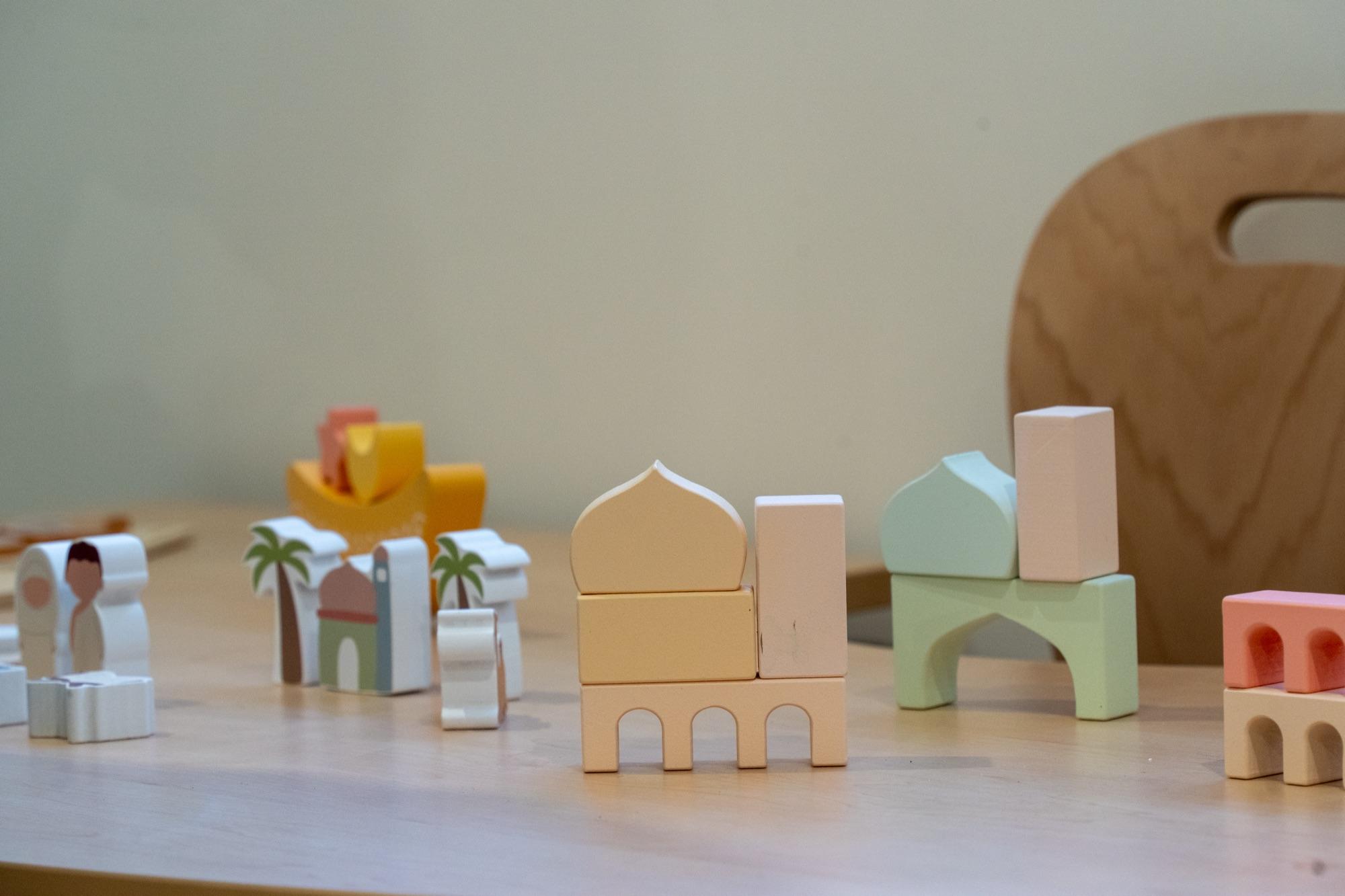 Wooden blocks shaped into a mosque with domes and minarets, set out for building