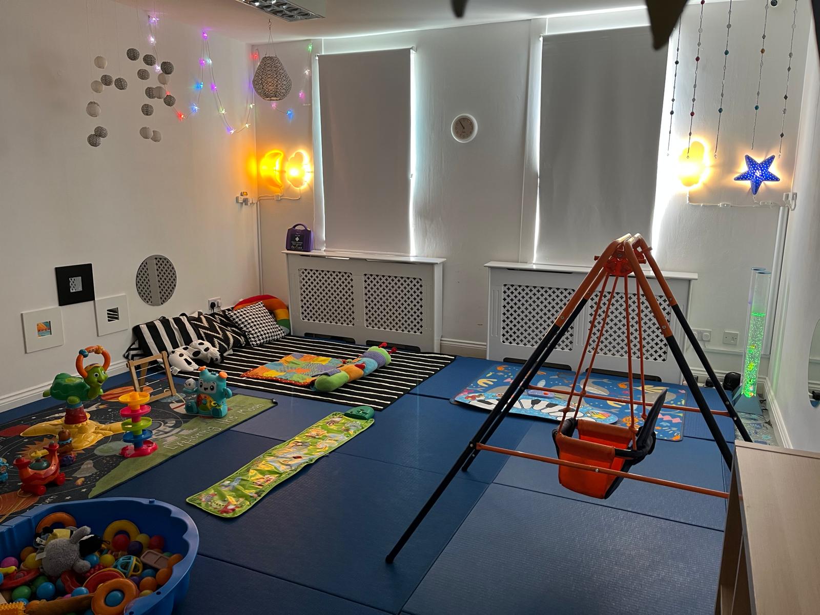 Buckingham Montessori sensory room — sensory swing, mood lights, soft floor mats and tactile toys