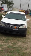 A neat white Toyota camry 2004 