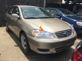 A Neat Gold Toyota Corolla 2004