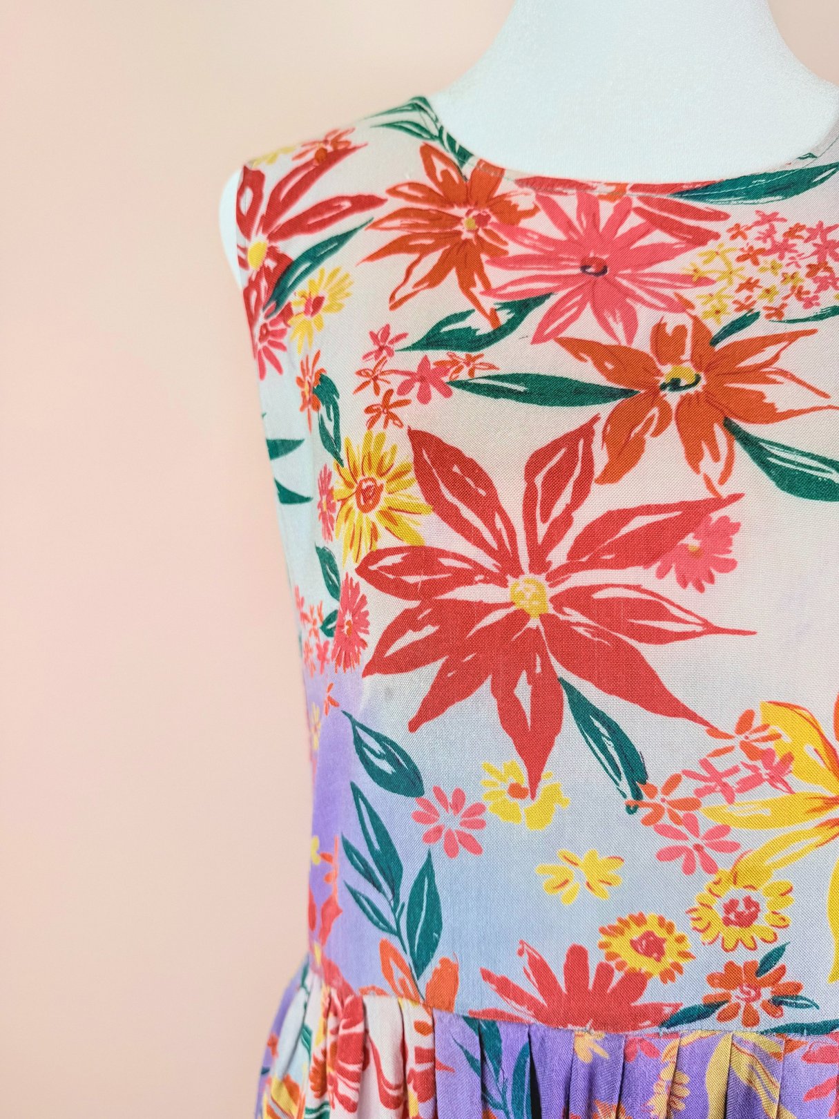 The Summer Bouquet Dress is a 1990s women's dress featuring a vibrant pink floral print.