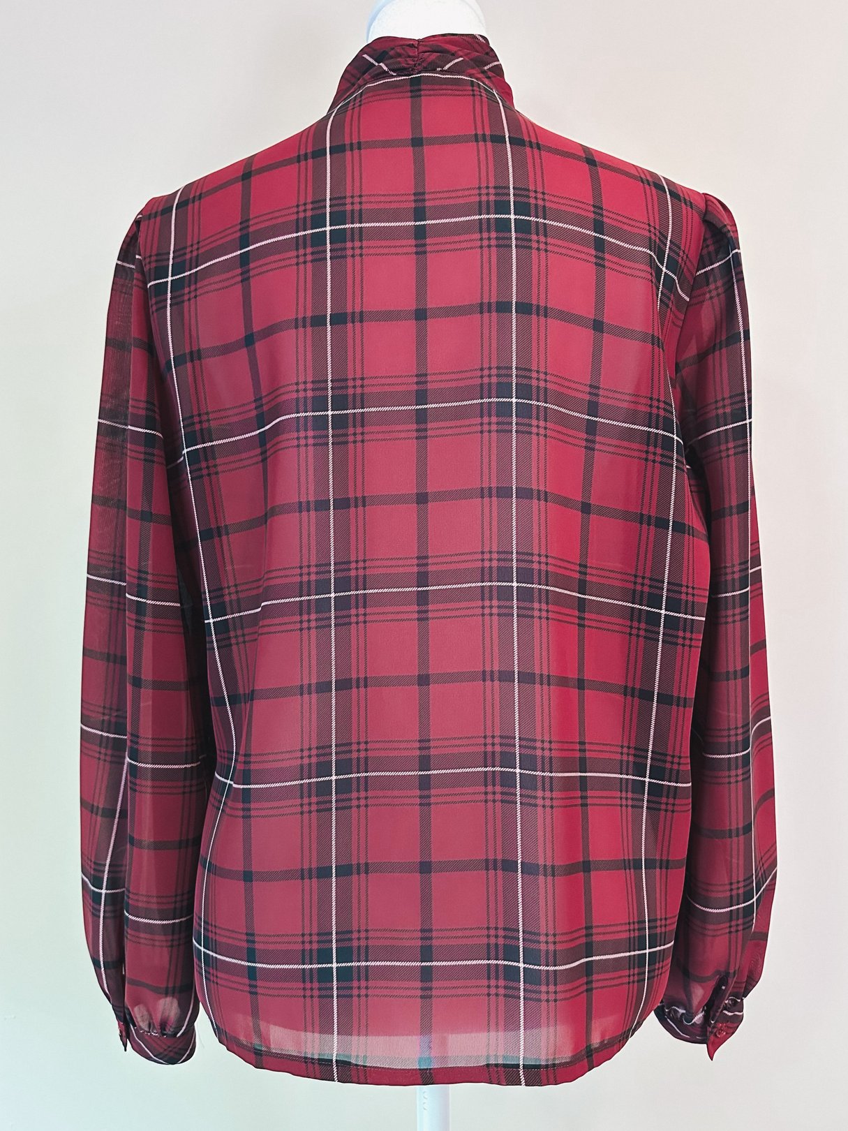 Maroon plaid blouse for women from the 1960s featuring long sleeves and a buttoned collar, displayed from the back.