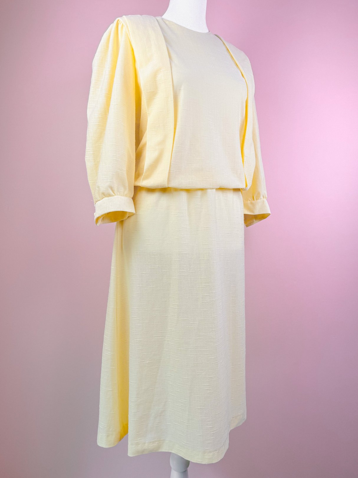 A yellow Lemon Chiffon Dress for women from the 1980s featuring a relaxed fit and puffed sleeves.