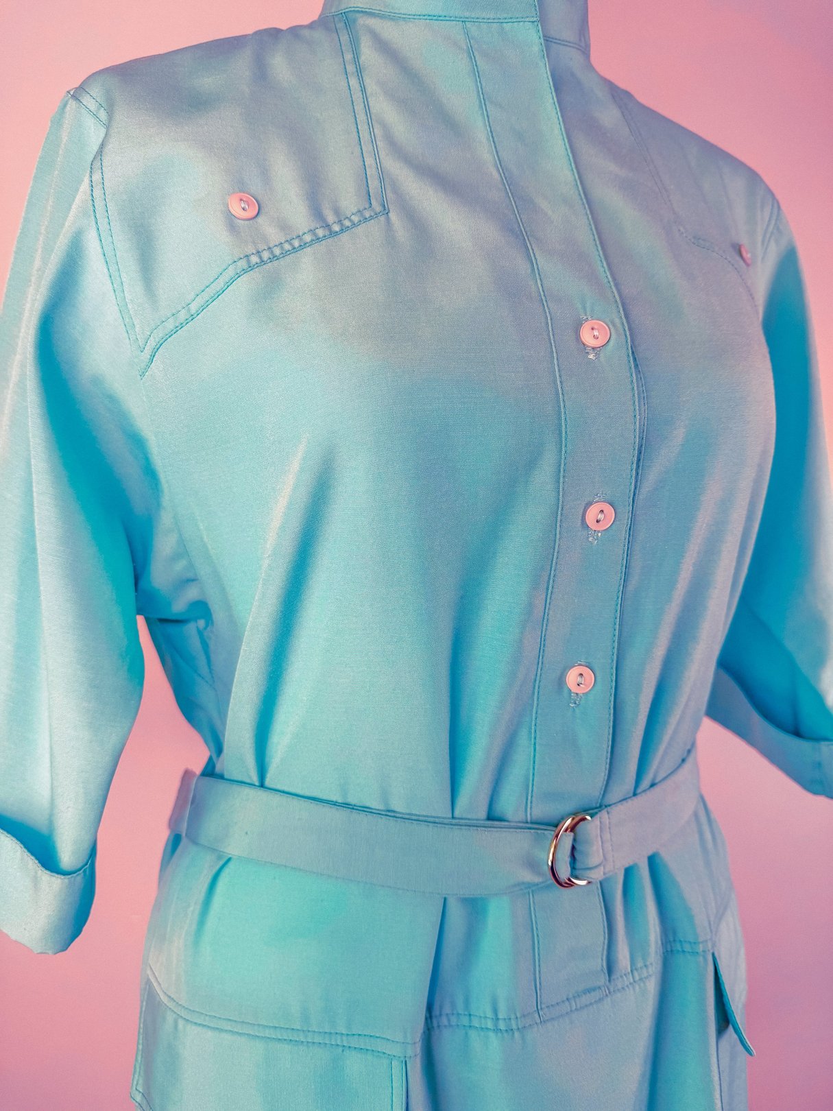 Skyline Shift Dress in sky blue featuring a collared neckline, button closures, and a belted waist, designed for women in the 1960s.