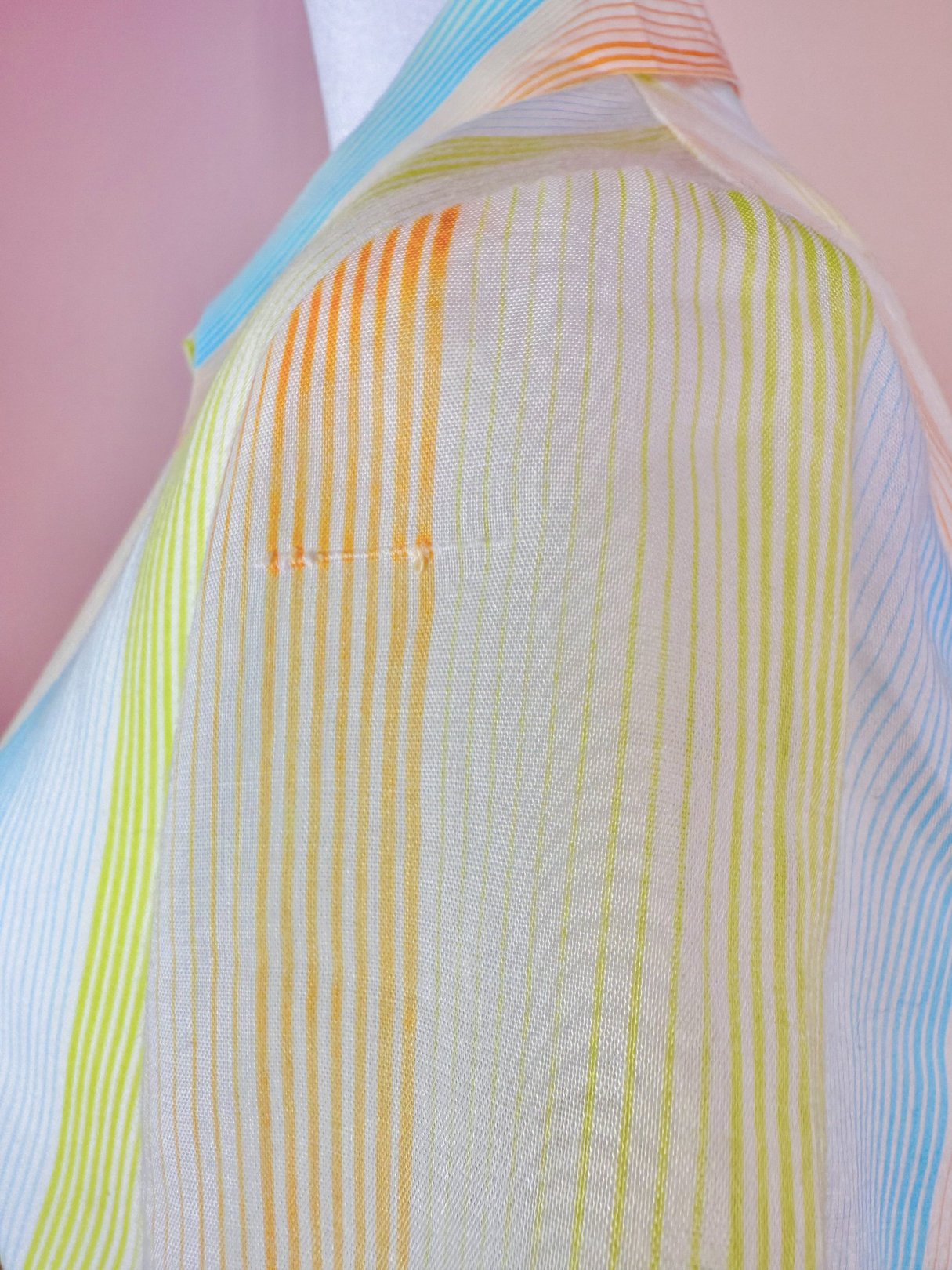 1950s women's Citrus Dress featuring horizontal stripes in orange and green hues.