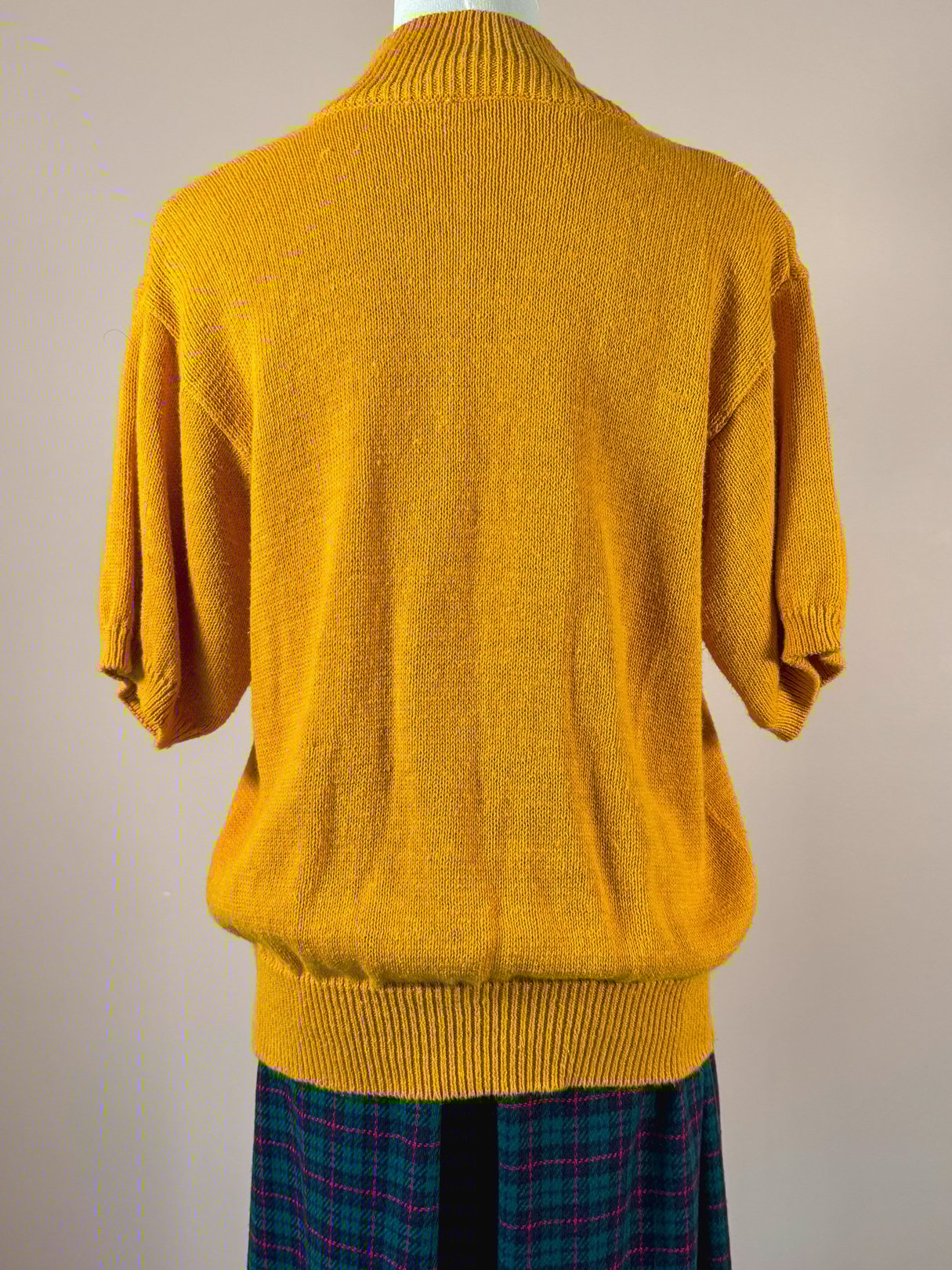 Persimmon orange 1980s women's sweater with a relaxed fit and short sleeves.