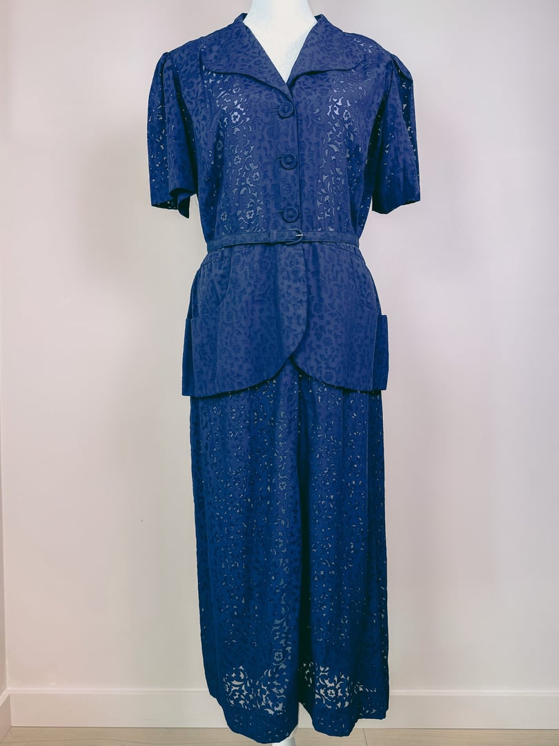 Navy blue 1940s women's French Café Dress featuring a short-sleeved blouse with buttons and a matching skirt.