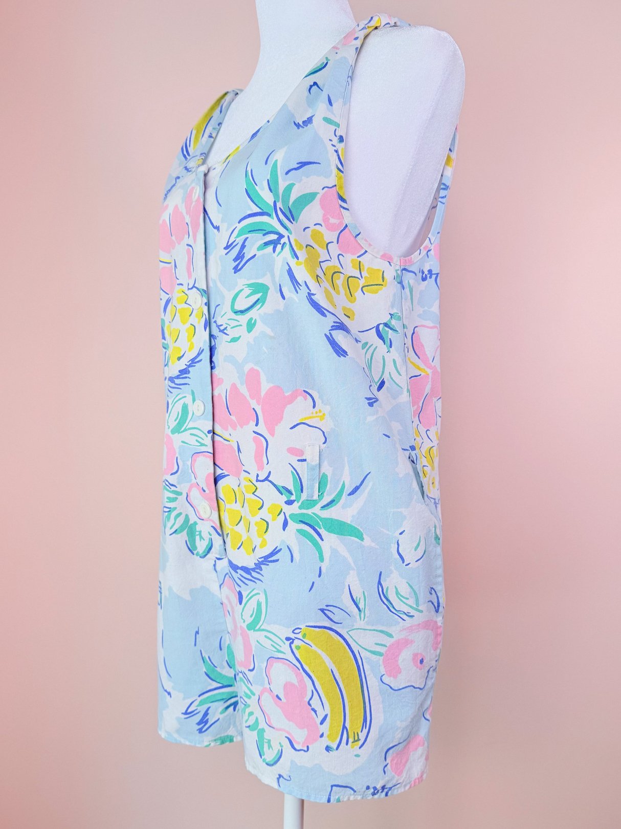 Women's 1980s Pineapple Party Romper in blue with a colorful floral and banana print.