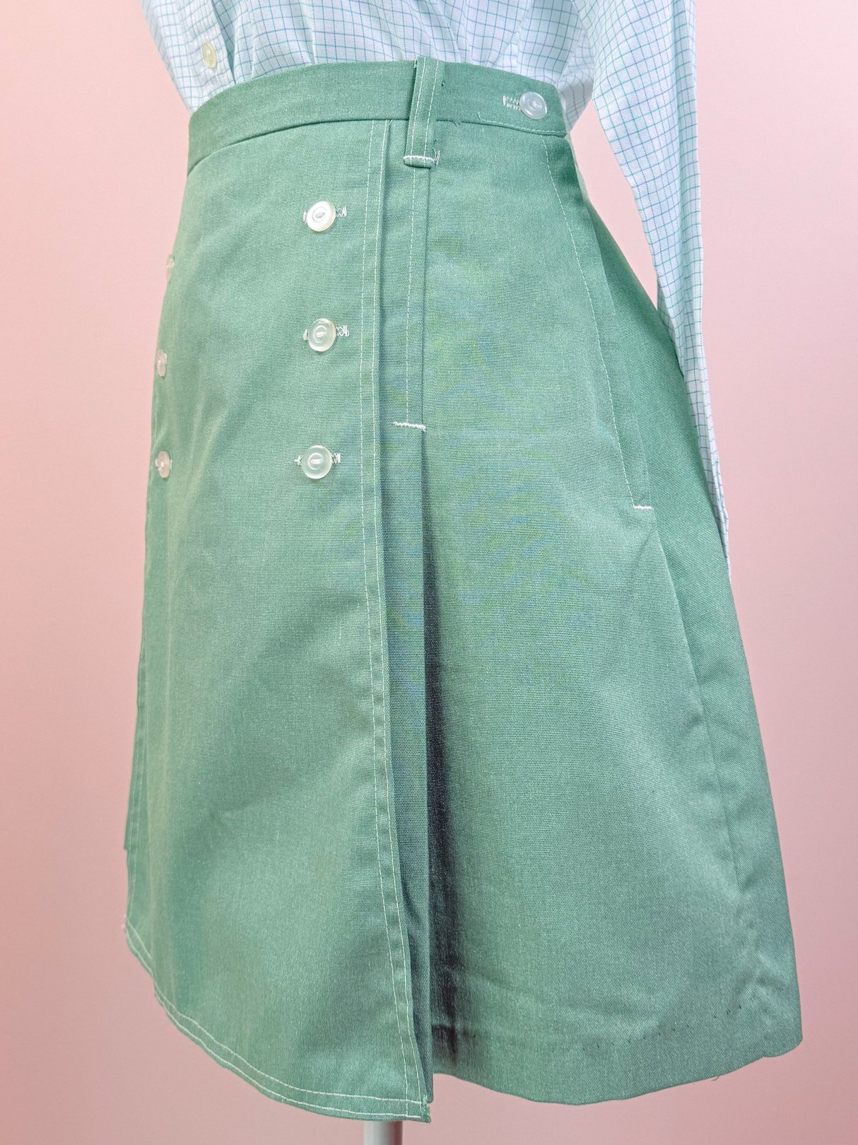 Green Gator Sailor Skort for women from the 1970s featuring a front flap and button details.