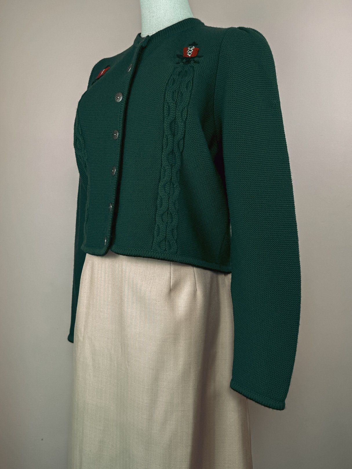 Green M & G Tulip Embroidered Cardigan for women from the 1980s, featuring cable knit details and decorative buttons, displayed on a dress form.