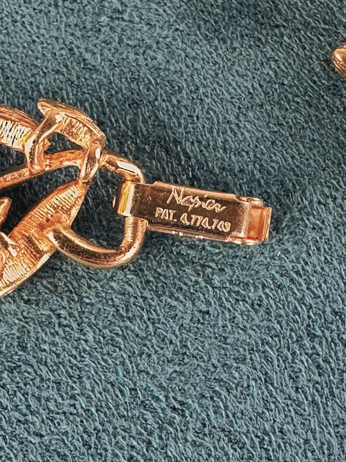 Gold-tone Napier collar necklace featuring a swirled vines design, dating to the 1970s.