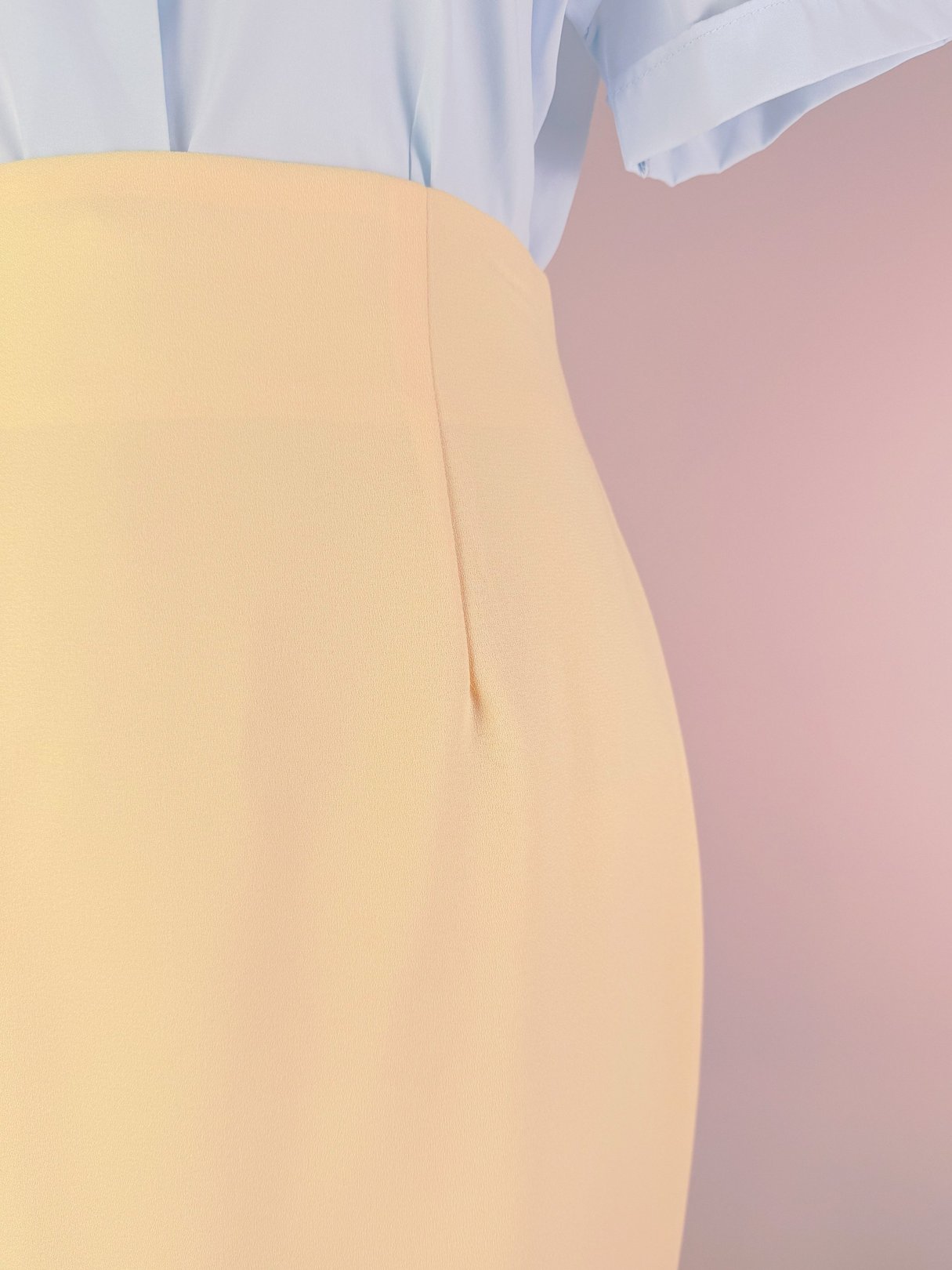 Buttery yellow 1990s women's skirt with a tailored waist and a side slit.