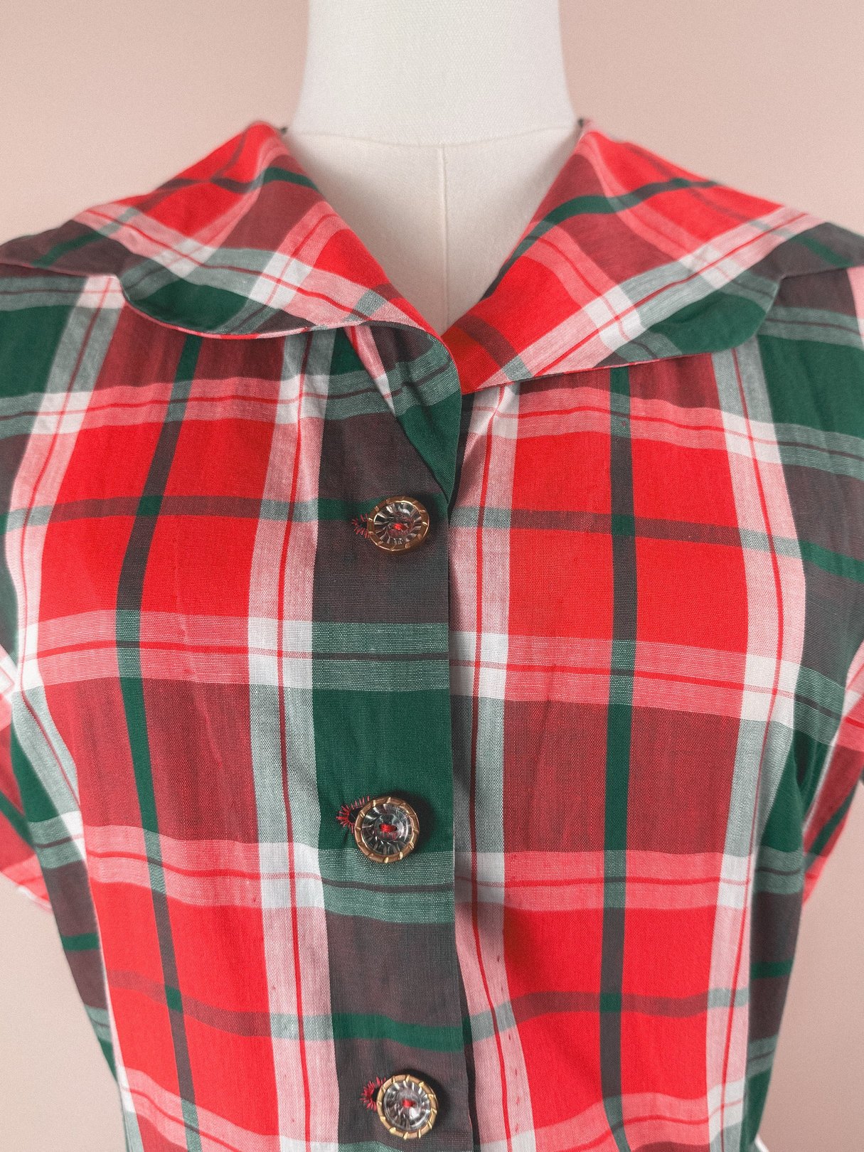 Red plaid dress for women featuring a wide collar and decorative buttons, inspired by 1950s style.