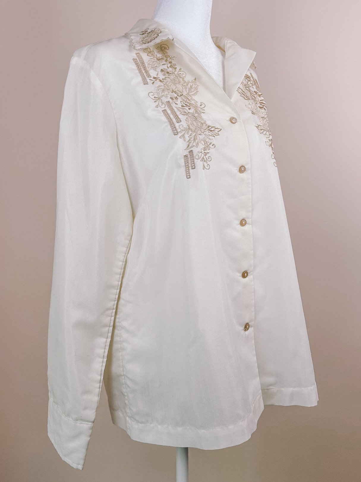 Cream-colored hand-embroidered scalloped button-down blouse for women, featuring decorative embroidery and a relaxed fit, typical of 1950s fashion.