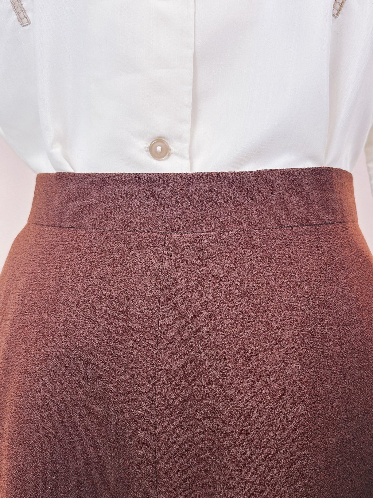 Brown women’s skirt from the 1970s featuring a high waistband and textured fabric.