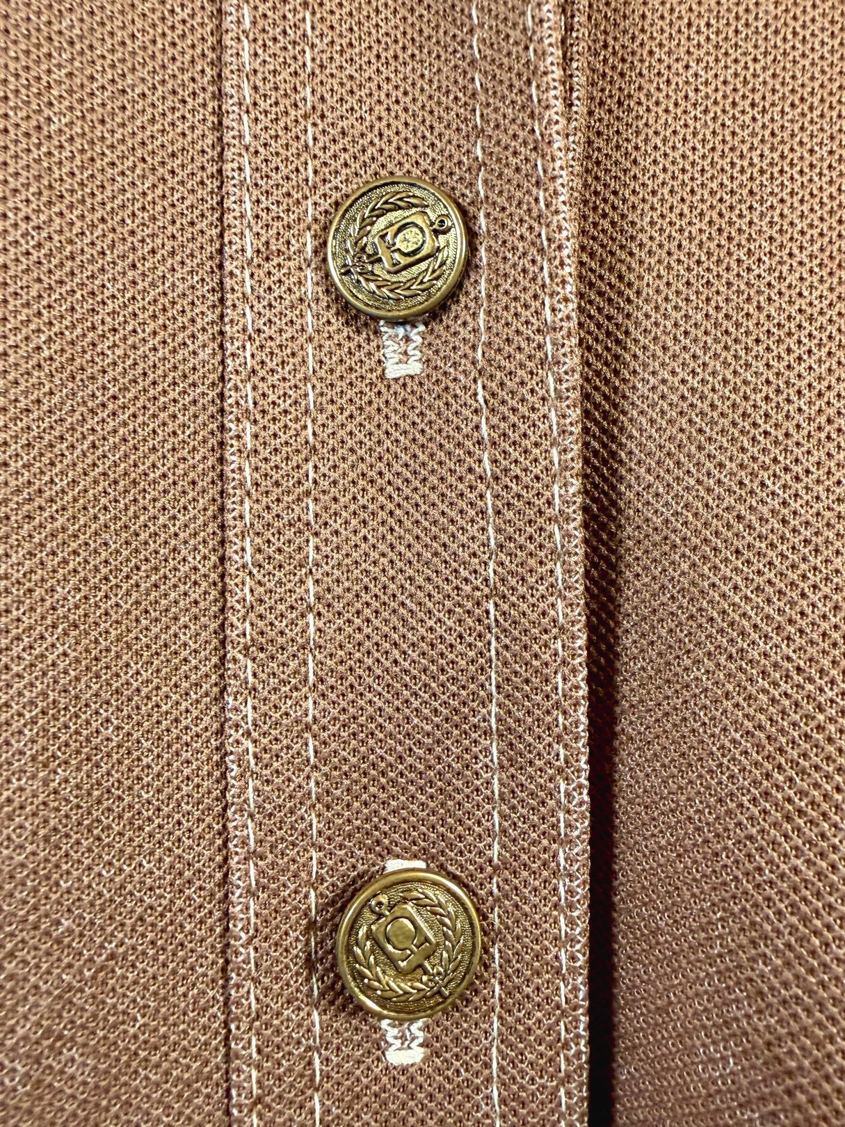 Brown 1960s women's chestnut jacket featuring decorative gold buttons and stitching details.