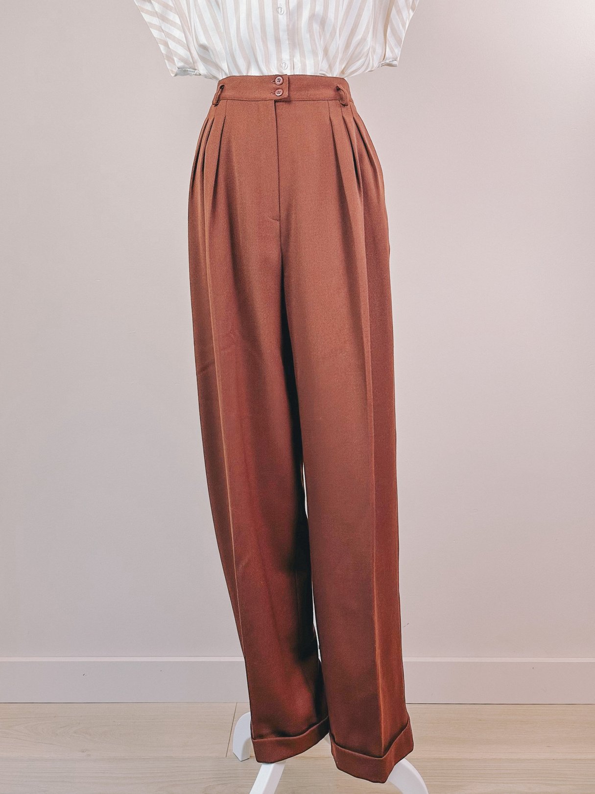 Chestnut high-waisted women's pants from the 1990s featuring a pleated front and wide legs.