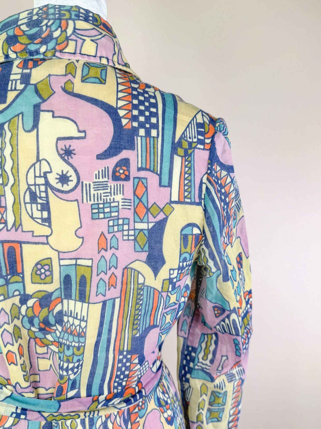 Cream 1970s Metropolis Dress for women featuring a colorful geometric pattern.