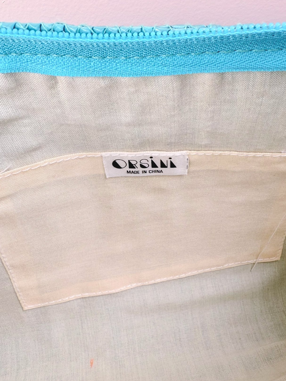 Teal blue Pacific Coast shoulder bag for women from the 1970s, featuring a label that reads "ORSINI MADE IN CHINA.