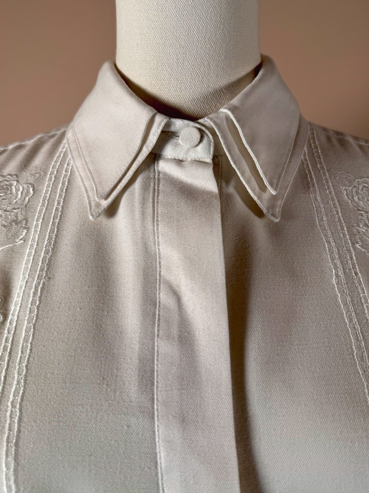 White 1970s women's Cloud Cotton Embroidered Shirt featuring a buttoned collar and embroidered details on the shoulders.