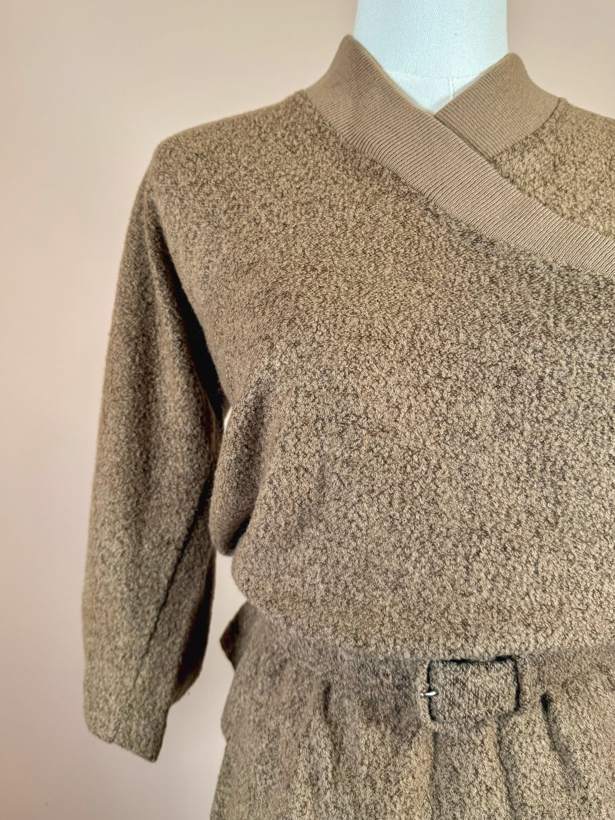 1950s women's Jantzen Hearthside knit set in tan featuring a textured sweater and matching skirt with a belted waist.