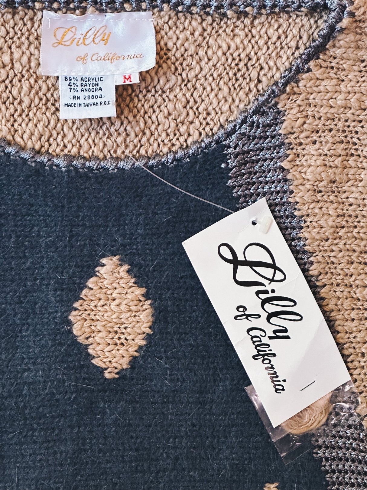 Blue 1980s women's Abstract Diamond Flagstaff Sweater with a diamond pattern and a label from Lilly of California.