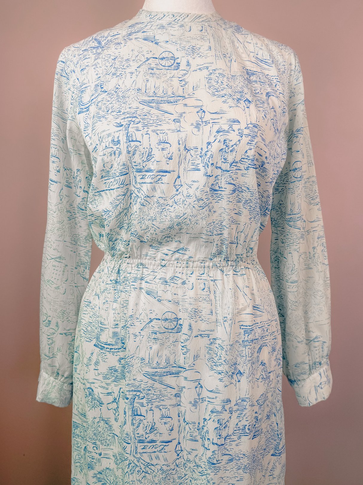 Blue, 1960s women's dress featuring a drawstring waist and a printed montage design.