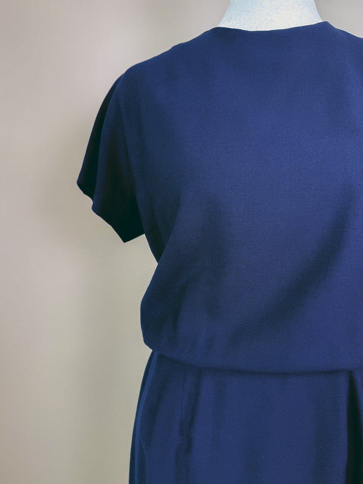 Navy blue dress set for women inspired by 1960s fashion.