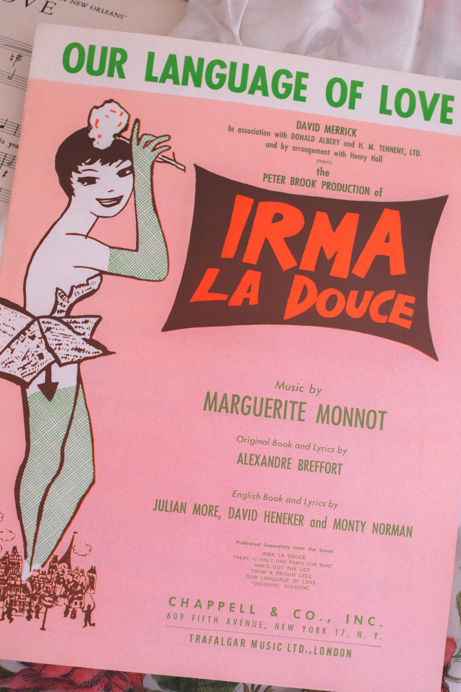 Sheet Music Stories gallery image: Sheet music cover for "Irma la Douce" featuring artwork with a woman in a provocative pose and bold, colorful text.