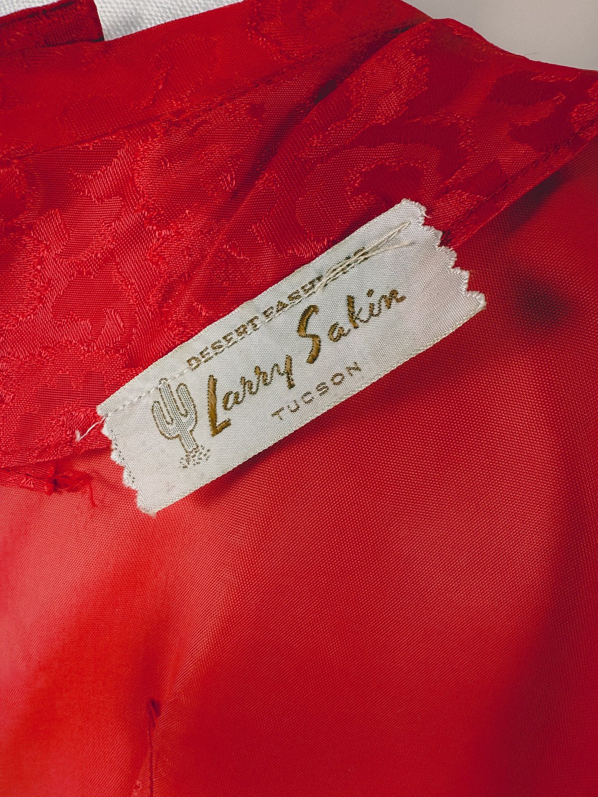 Red Damask Dress by Larry Sakin featuring a texture pattern suitable for women, reflecting 1950s fashion.