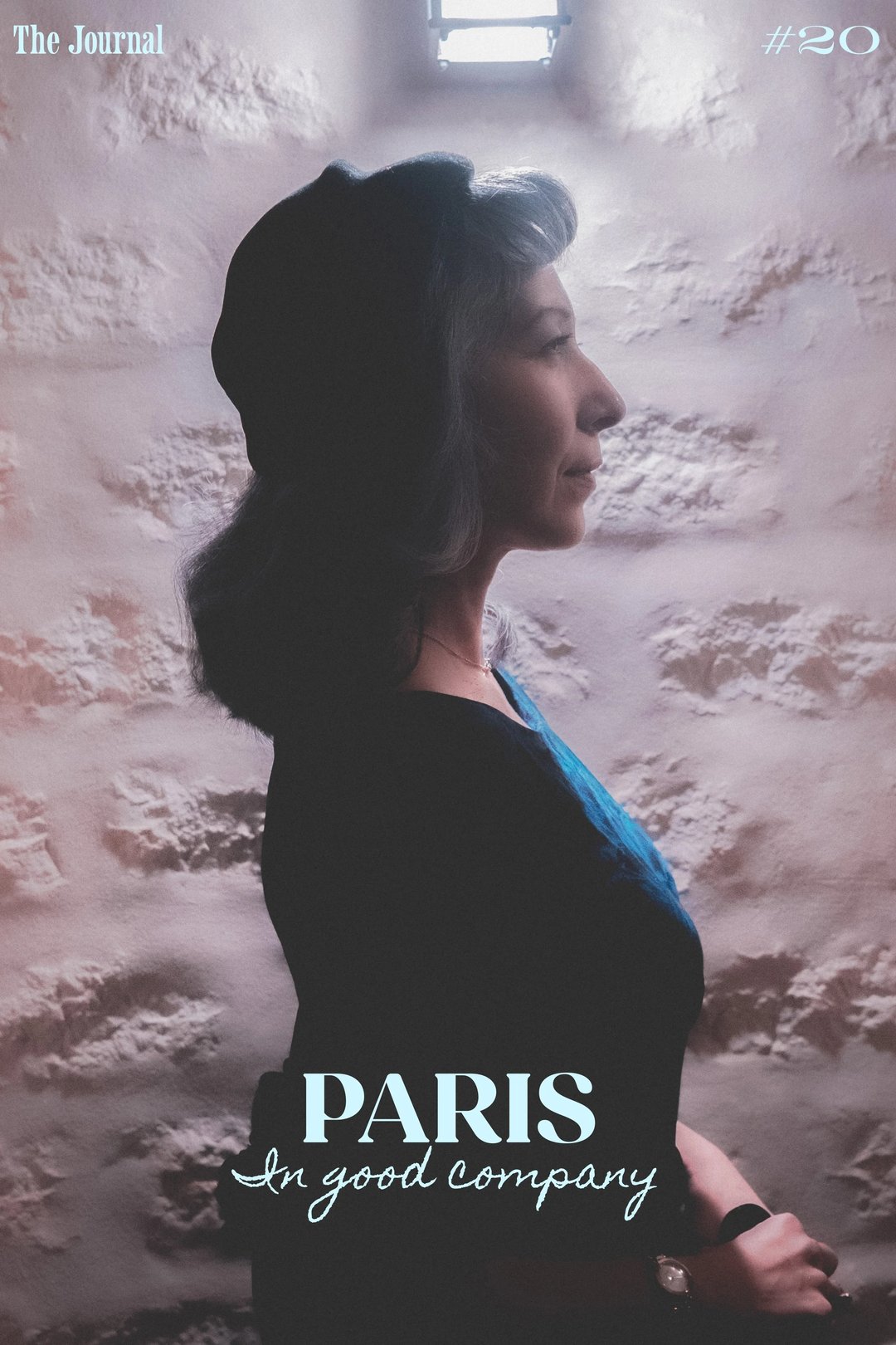 A profile view of a woman wearing a black beret against a textured wall, with the text "PARIS In good company" at the bottom.