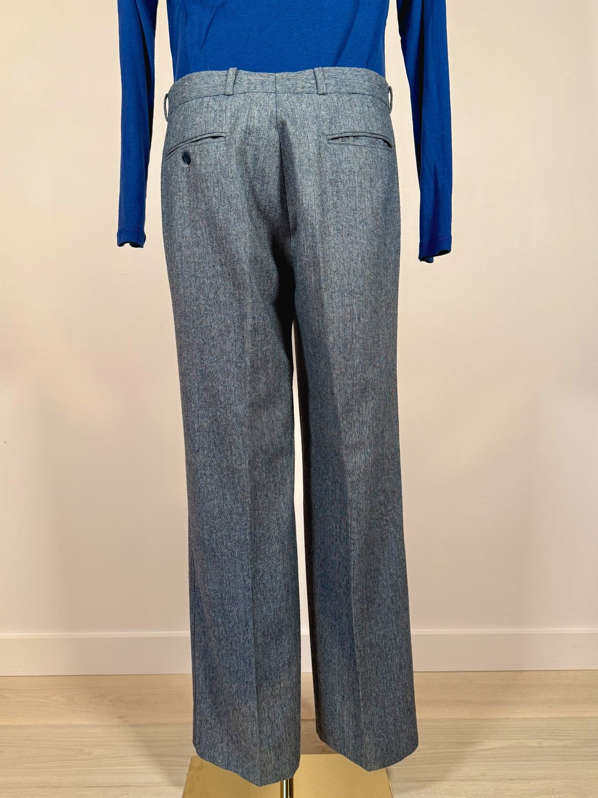 Men's blue Nino Cerruti trousers from the 1980s featuring a classic straight-leg design and back pockets.