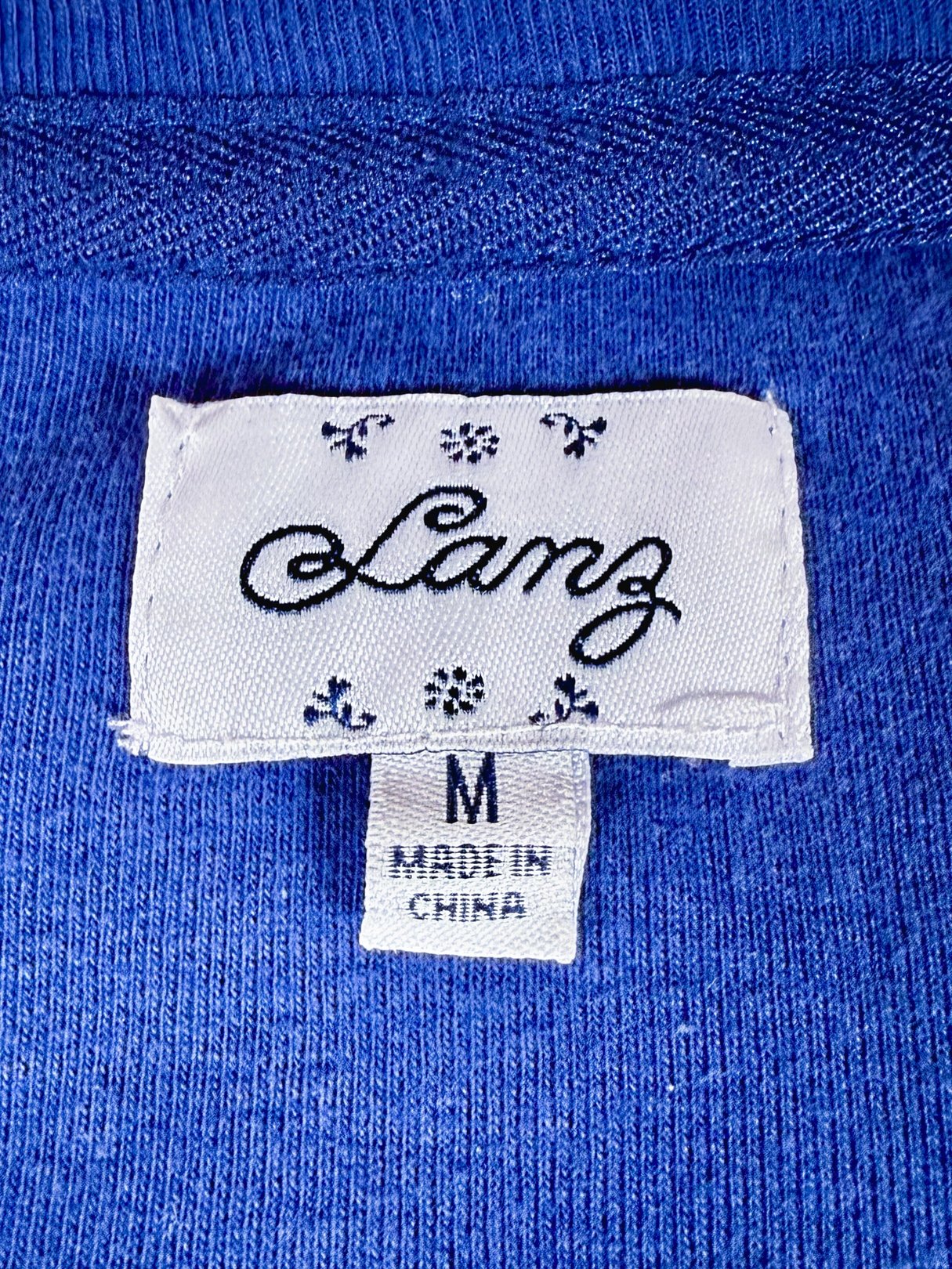 Men's Lanz Baseball Henley in royal blue from the 1990s with a tag indicating size Medium and made in China.