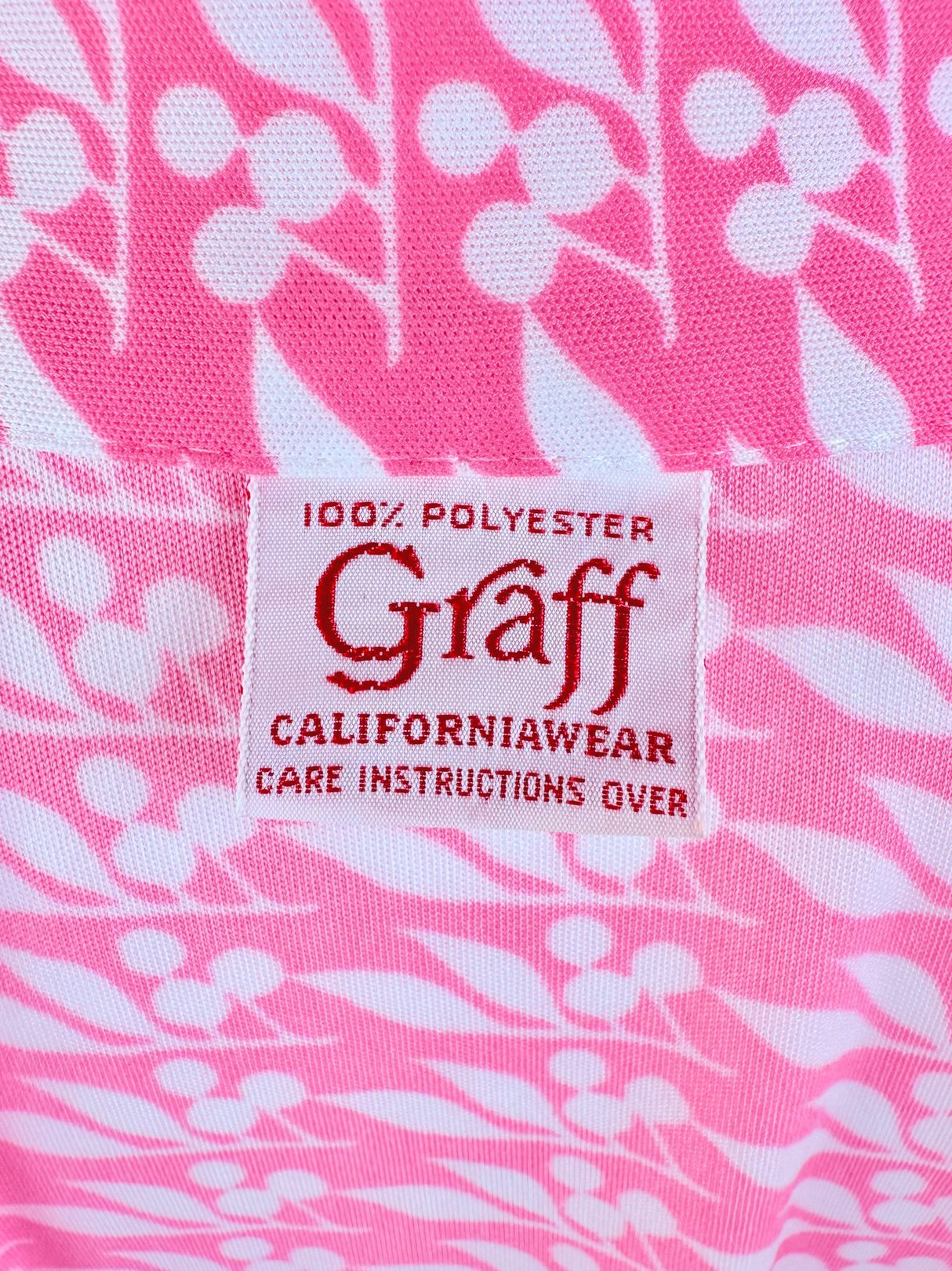 Pink Cherry Petal Blouse by Graff CaliforniaWear featuring a floral pattern and care instructions label.
