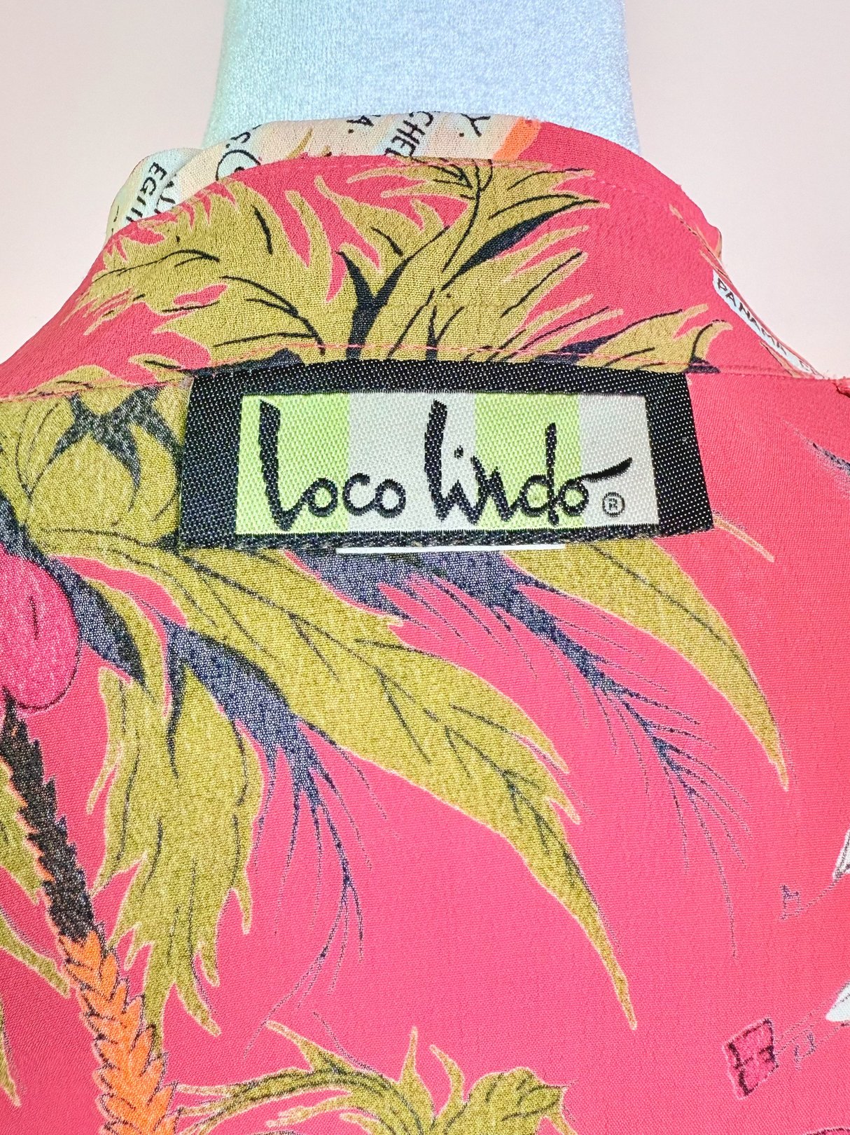 1970s women's white top with a floral print, featuring a "Loco Lindo" label.
