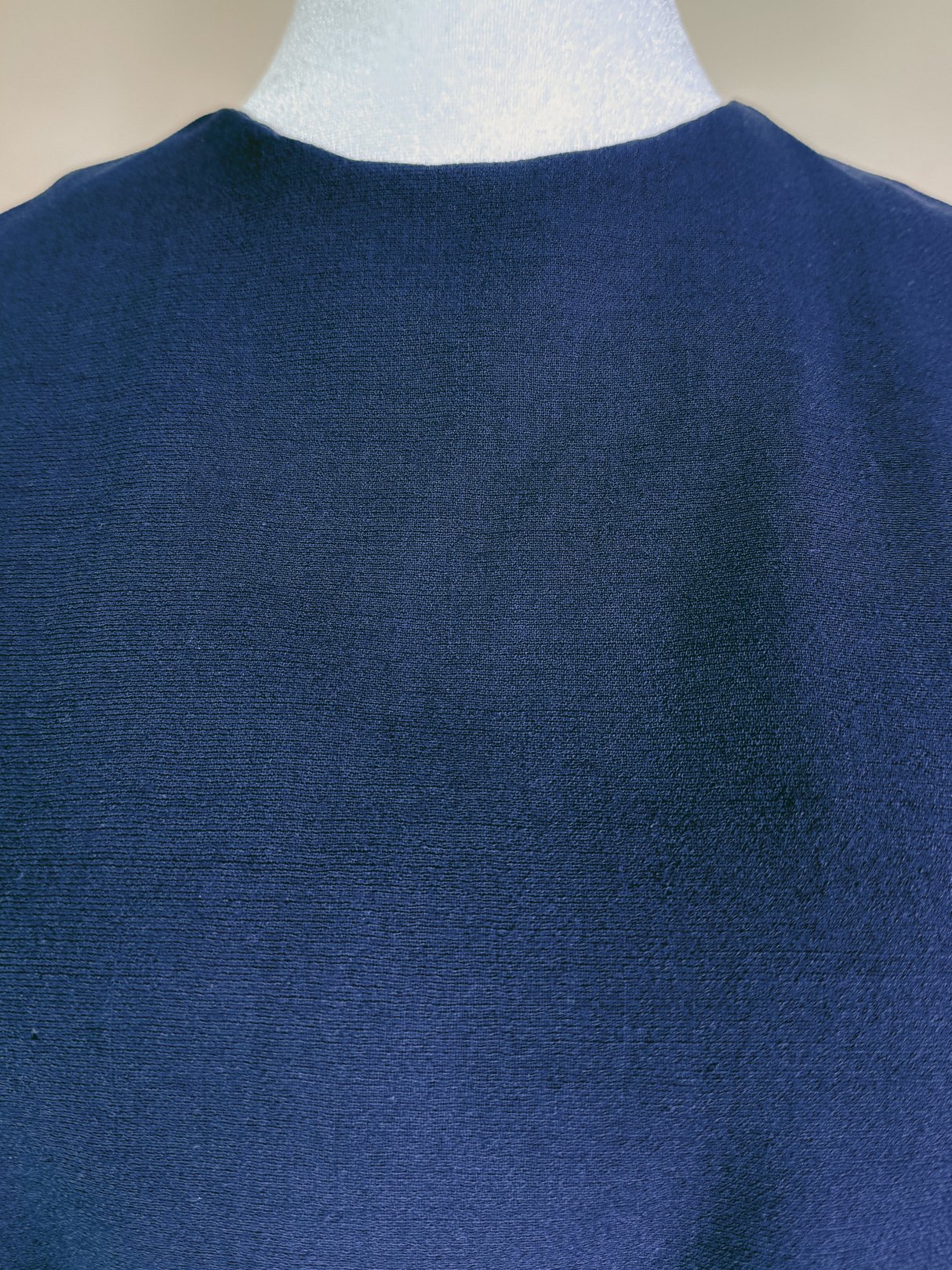 Navy blue 1960s women's dress set displayed on a mannequin, showcasing the back view.