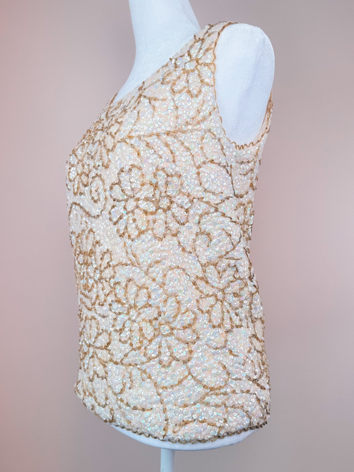 White 1960s women's top adorned with floral bead and sequin detailing.