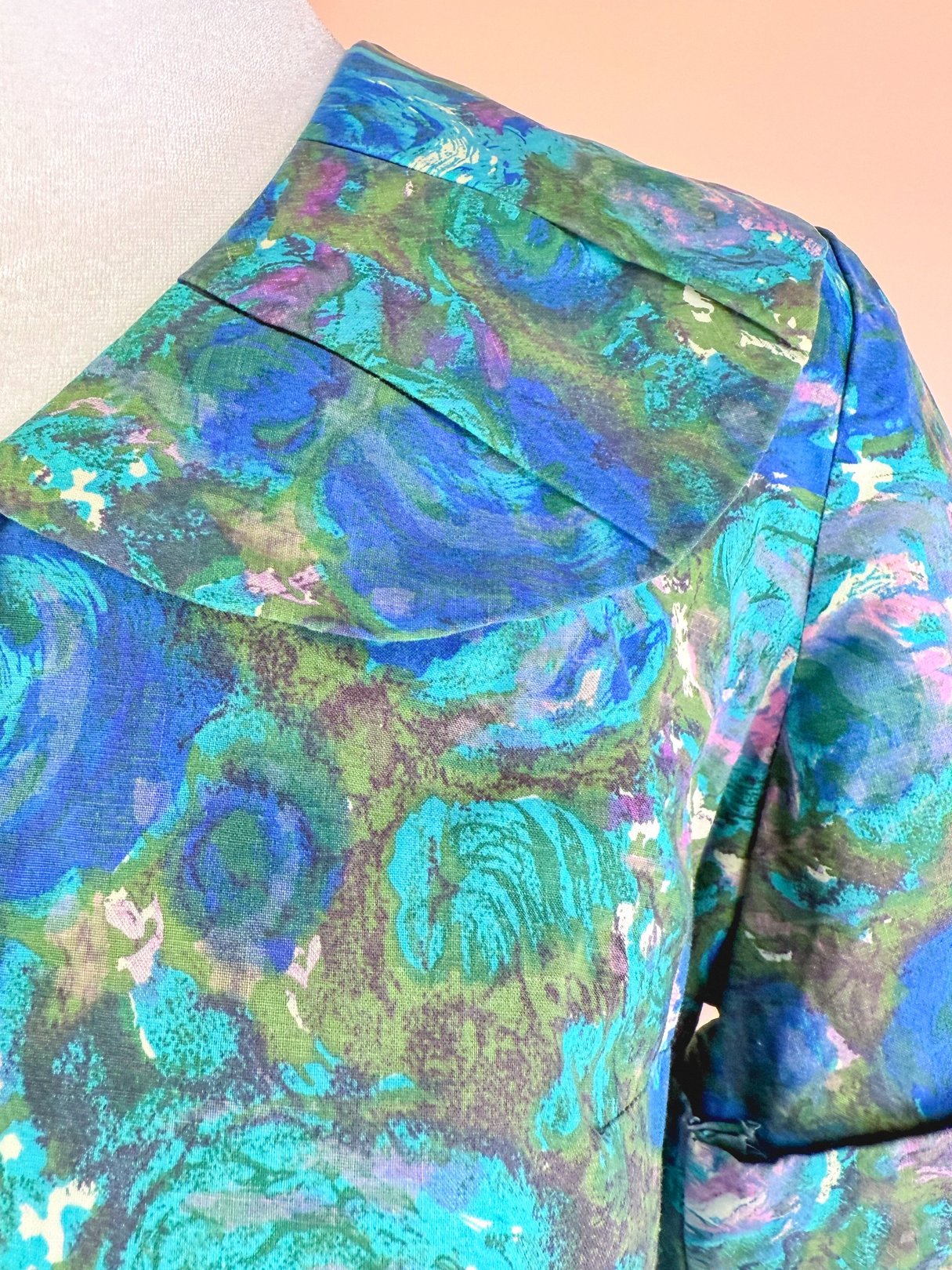 1950s women's Coastal Flowers skirt set featuring vibrant blue and green floral patterns.