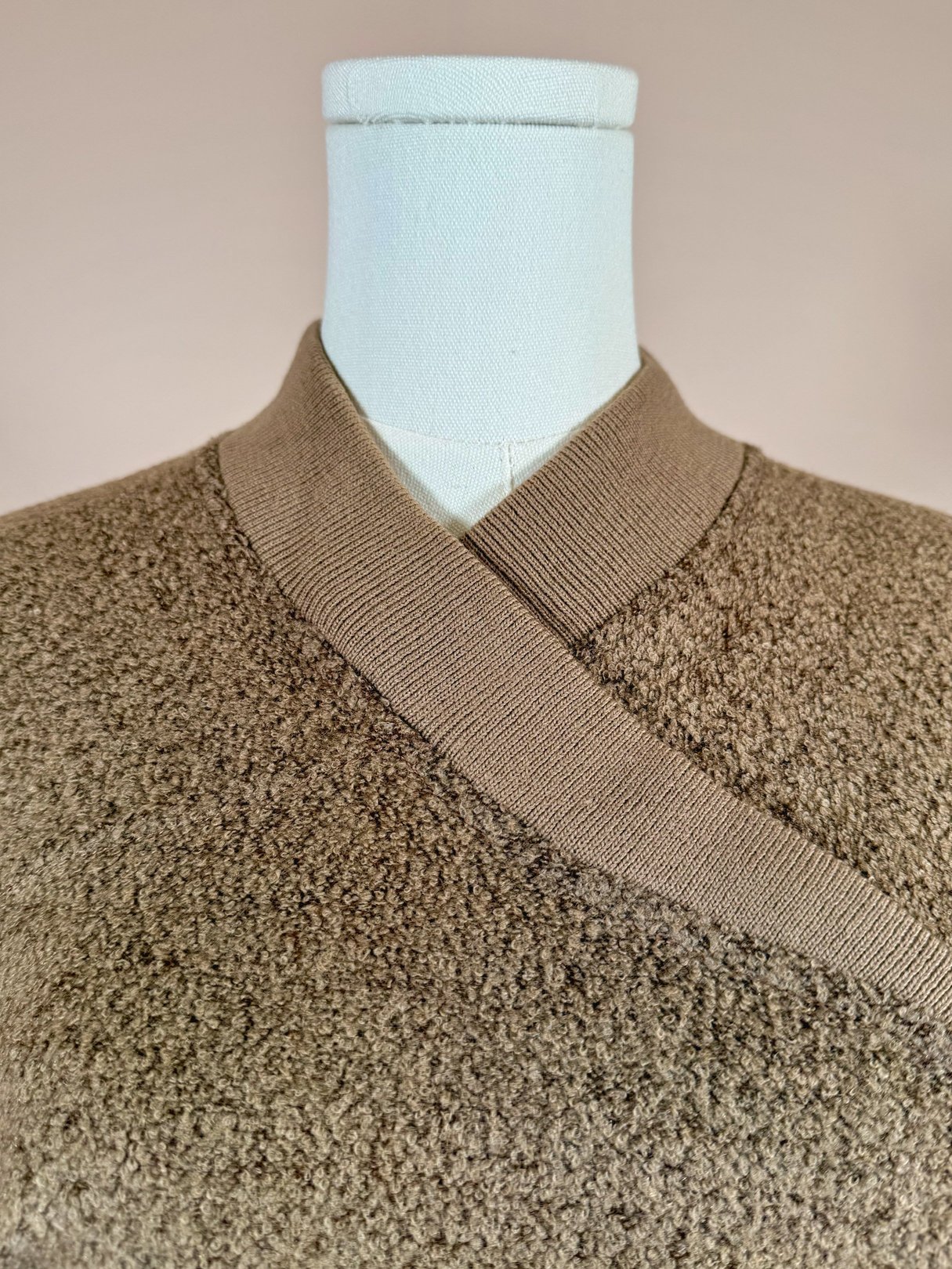 Tan 1950s women's Jantzen Hearthside knit set featuring a wrap-style neckline and textured fabric.