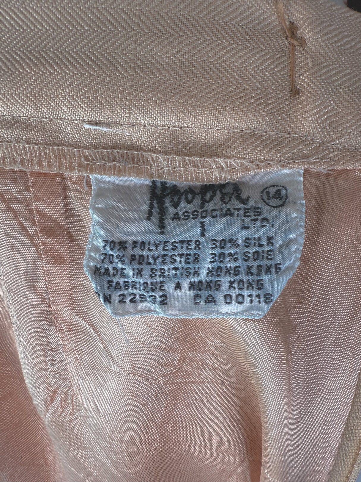 Cream beige women's skirt from the 1960s, labeled with fabric composition details including polyester and silk.
