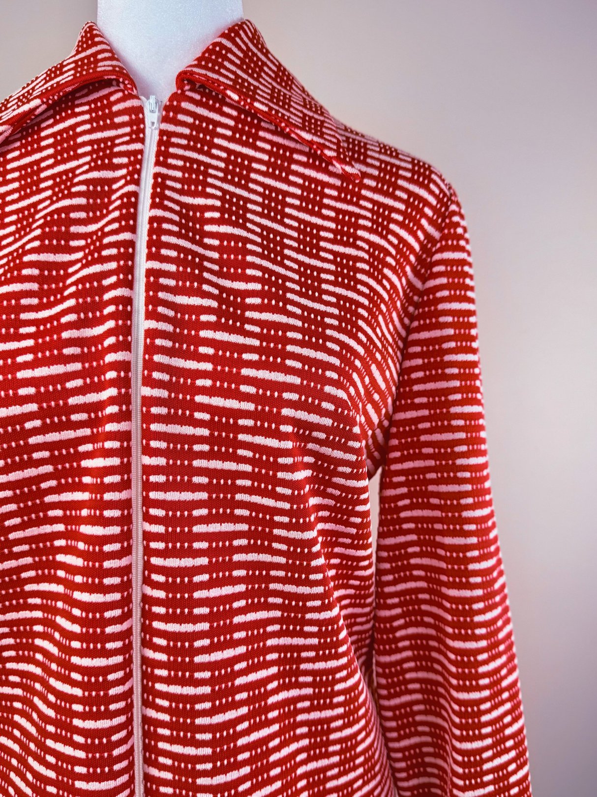 Red knit dress featuring a checkered pattern, designed for women, inspired by the 1970s era.