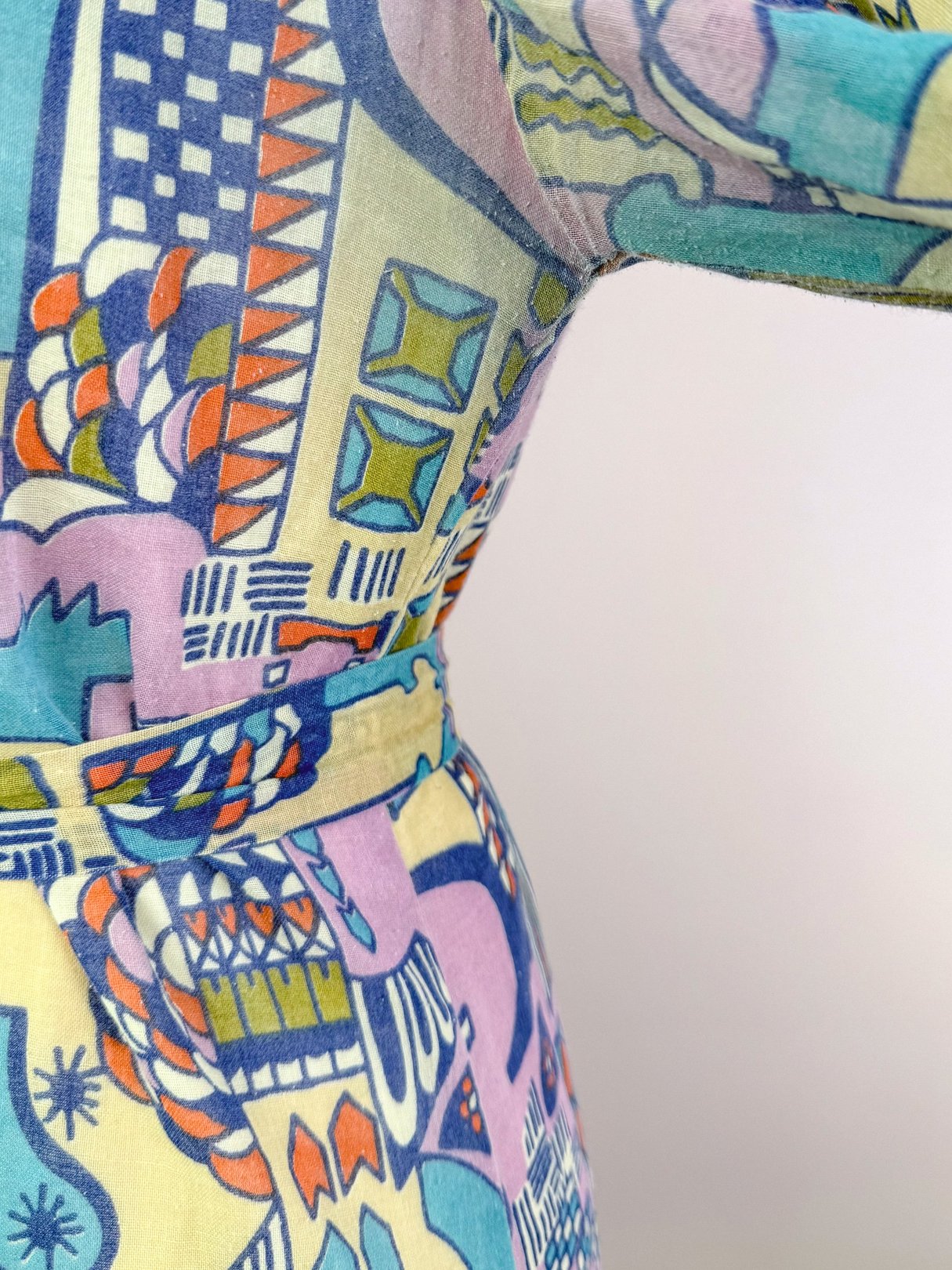 Cream 1970s Metropolis Dress for women featuring colorful geometric patterns.