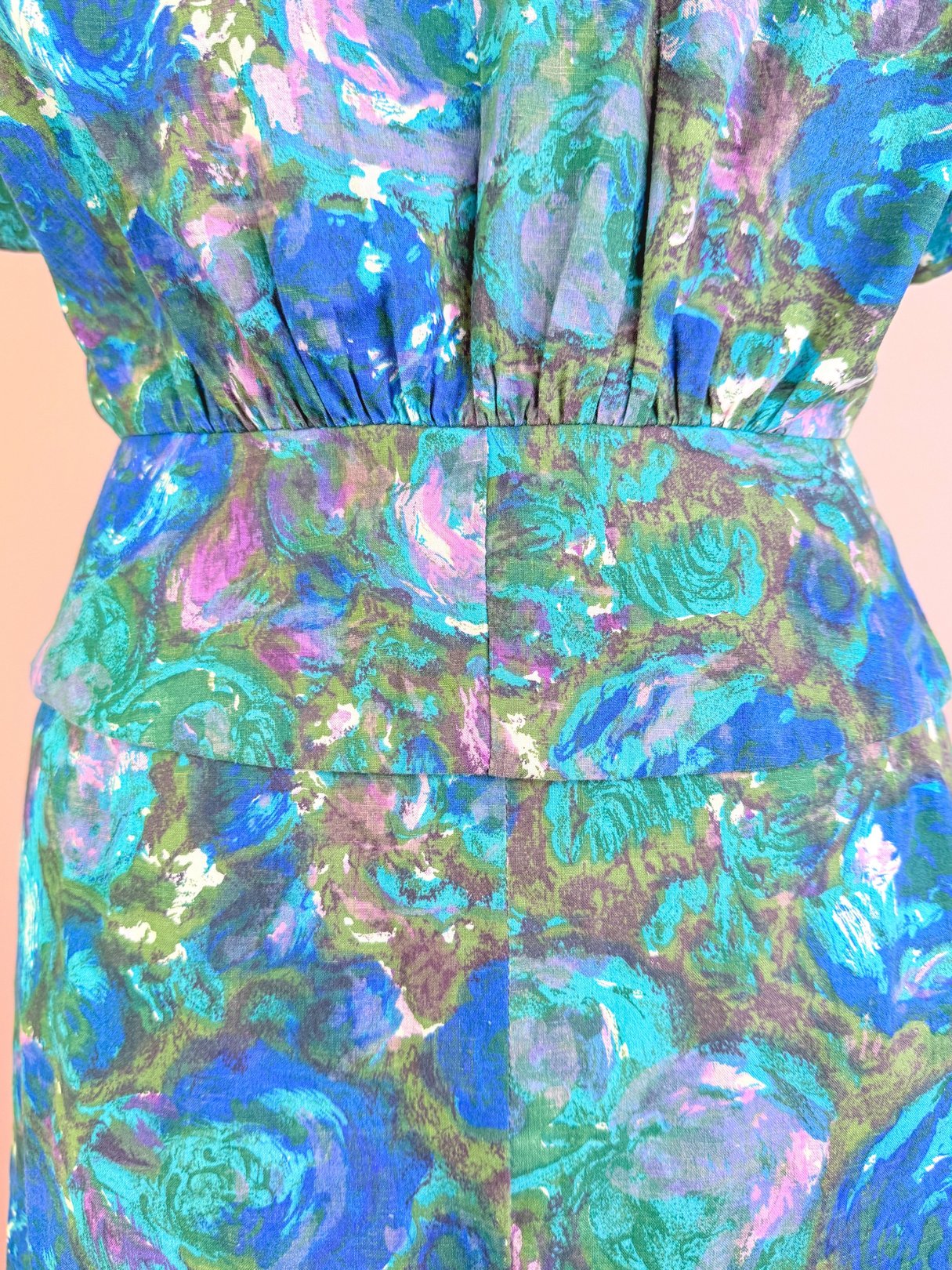 1950s women's Coastal Flowers skirt set in blue with floral patterns.