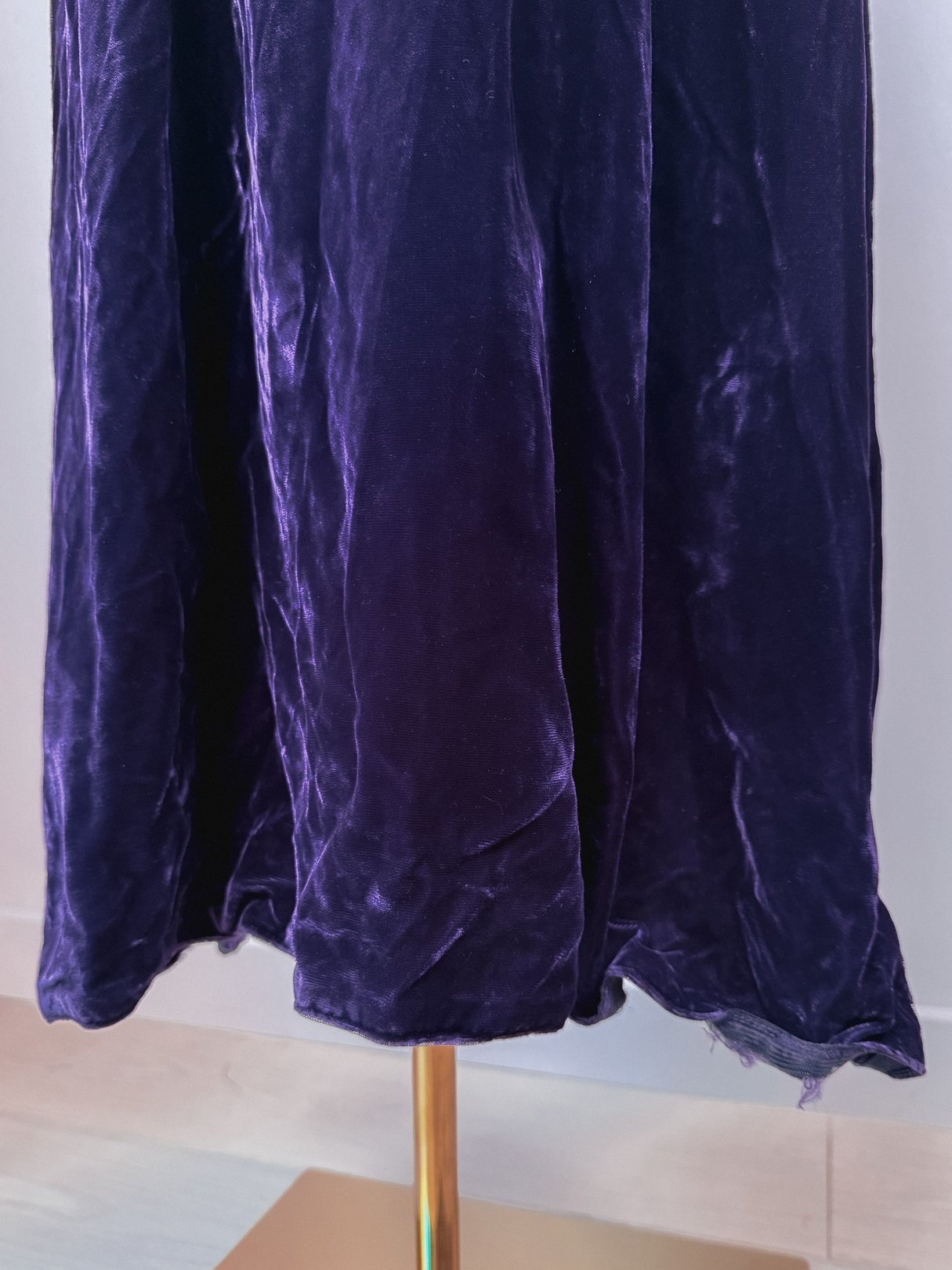 Purple velvet dress featuring a 1960s silhouette.