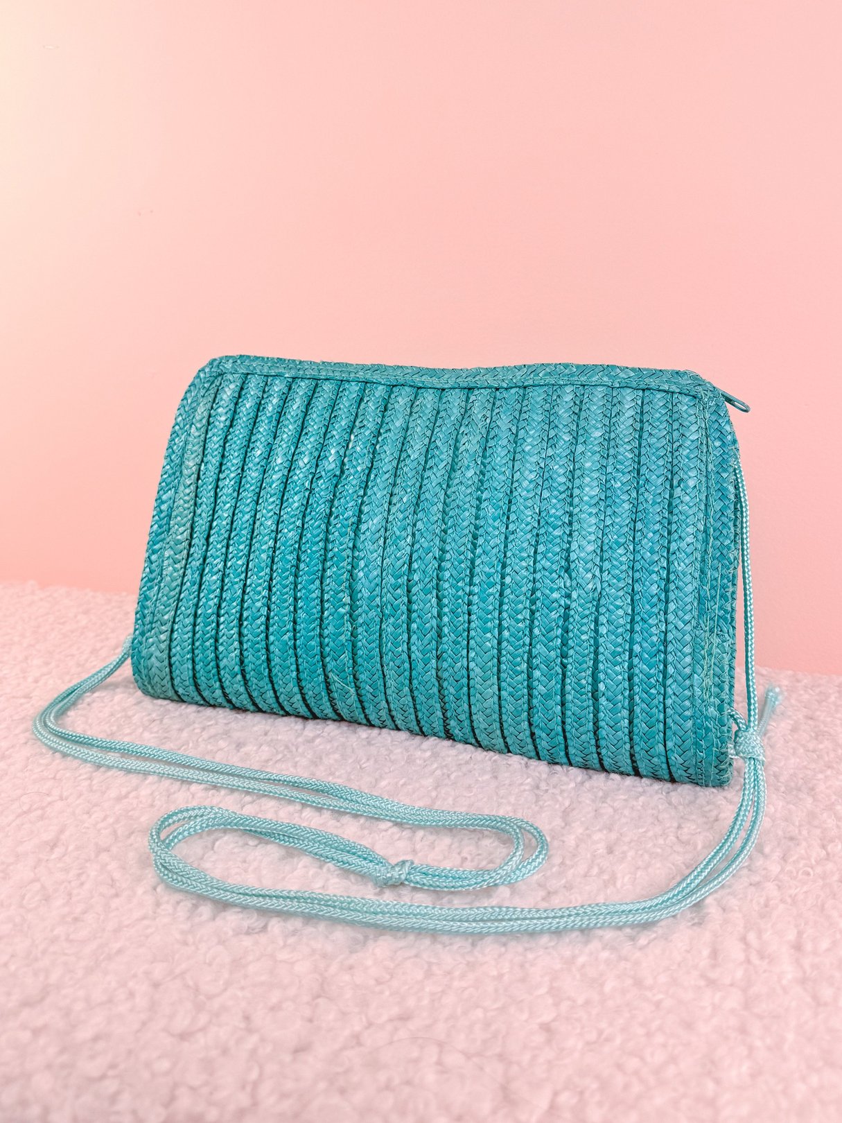 Teal blue woven shoulder bag with a textured design from the 1970s for women.