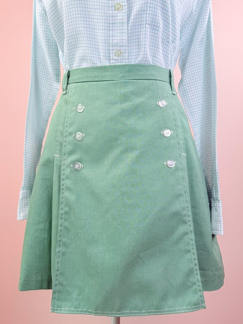 Green 1970s Gator Sailor Skort for women, featuring a flared design and button detailing on the front.
