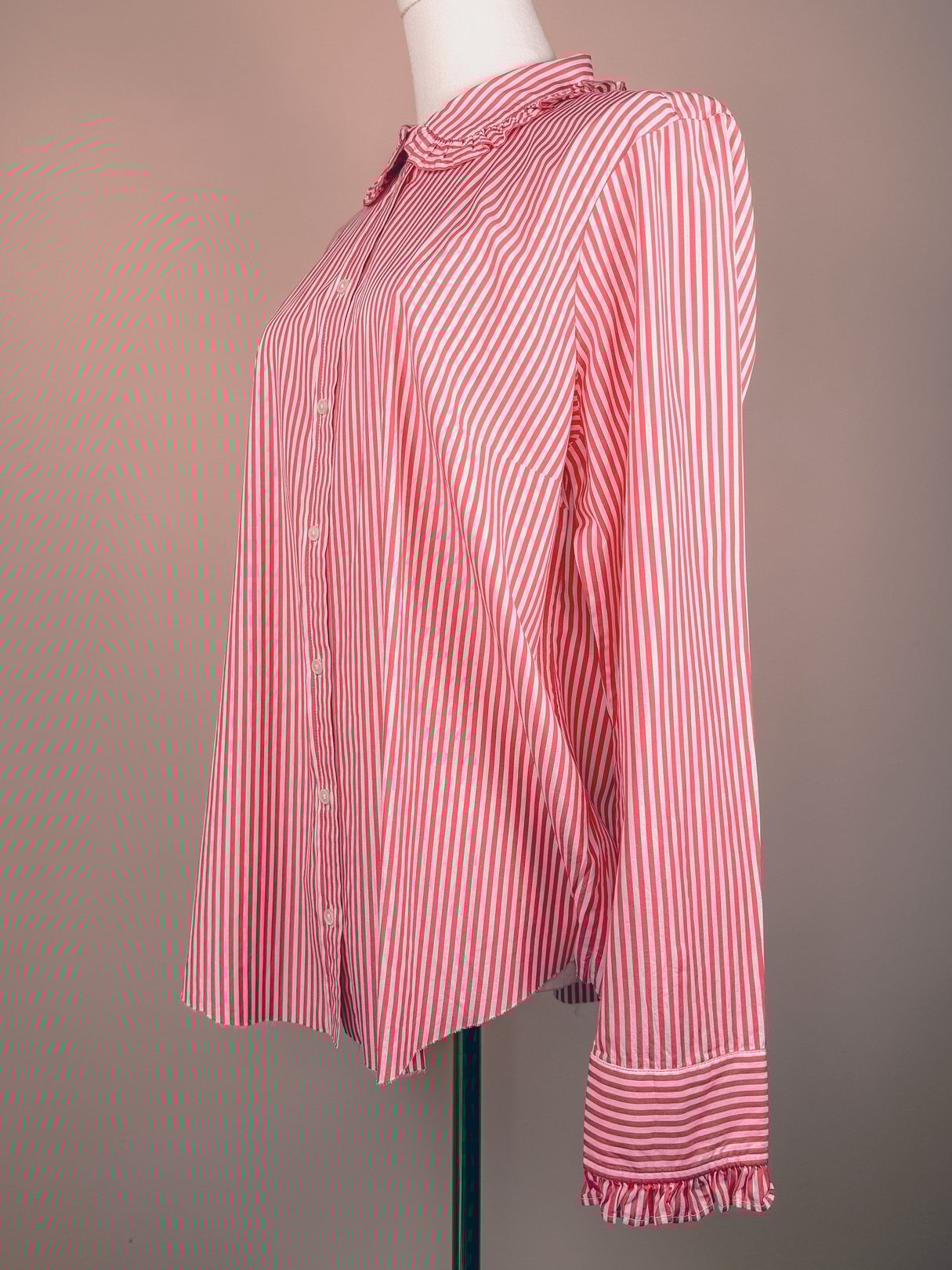 Red and white peppermint striped button-down top for women from the 1970s, featuring a collar and ruffled cuffs.