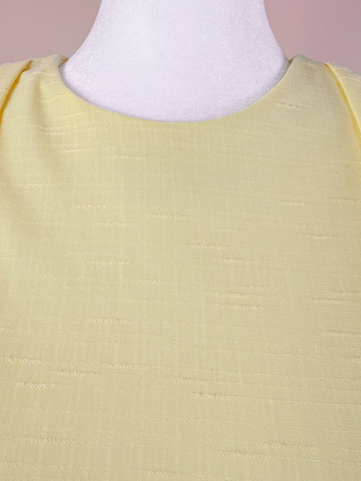 Lemon chiffon dress in soft yellow fabric featuring a classic neckline, suitable for women and reflecting 1980s style.