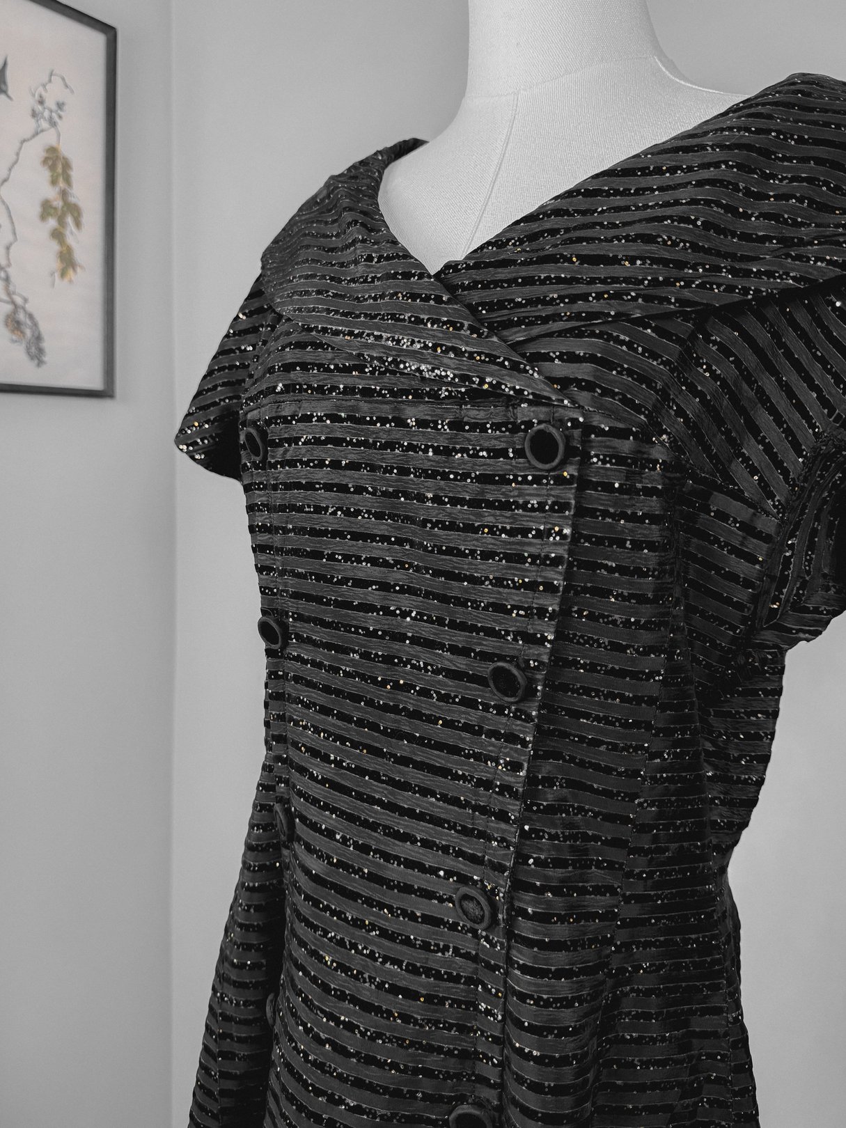 Black 1950s-style Confetti Party Dress featuring a notable collar and button accents.