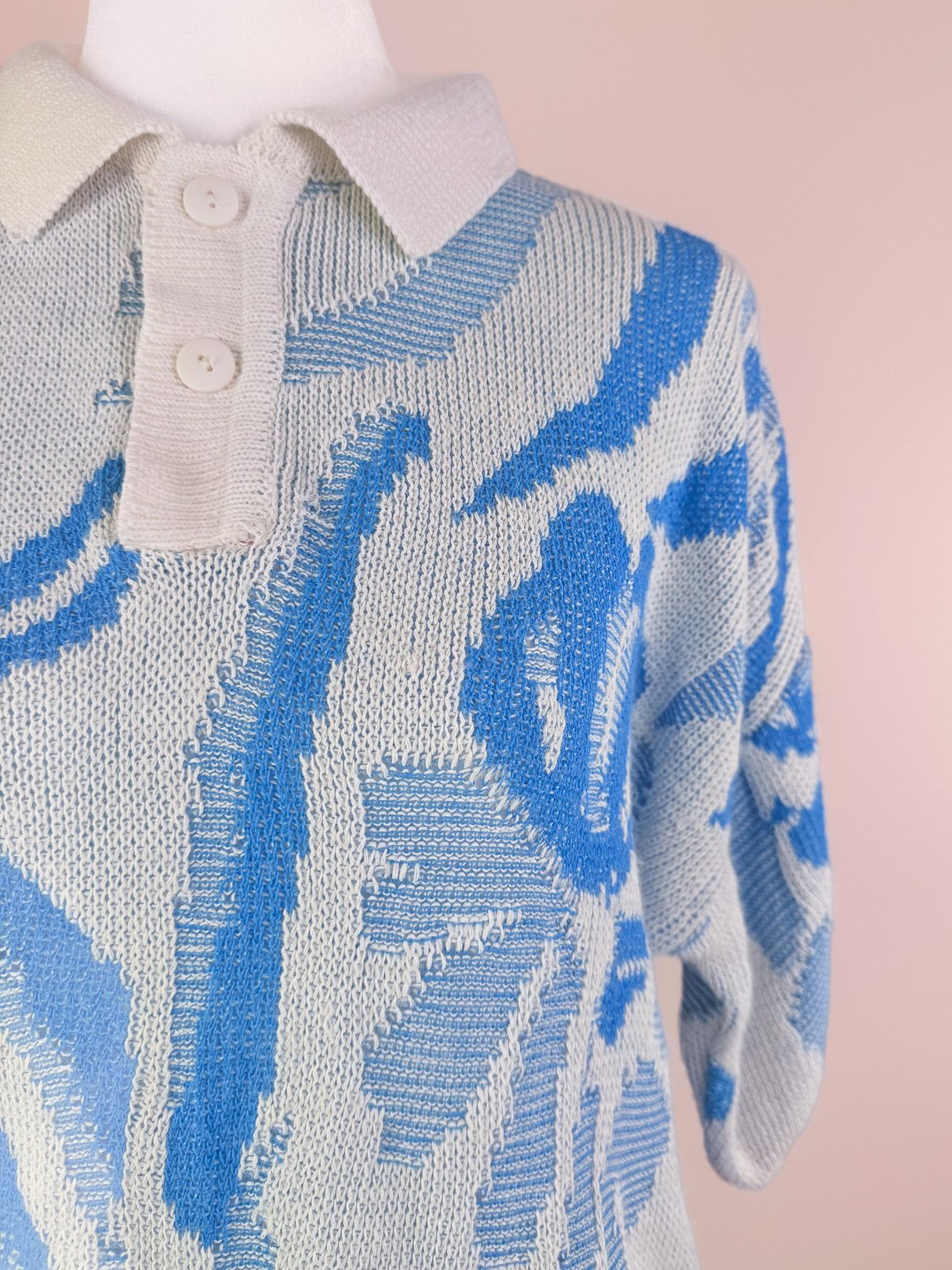 White and blue Yasaki Knit Polo Sweater for women, featuring a collared neckline and short sleeves, designed in a 1980s style.